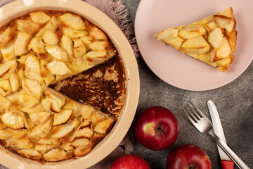 Freshly baked clafoutis pie with apples. Apple pie. Top view.