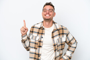 Young caucasian handsome man isolated on white background showing and lifting a finger in sign of the best
