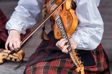 A fiddler woman on the traditional Norwegian fiddle 