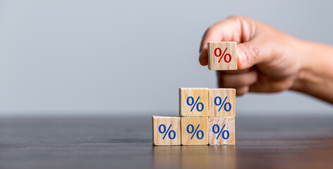 Closeup wood cubes with percentage symbol, Interest rate and dividend concept, wooden block with...