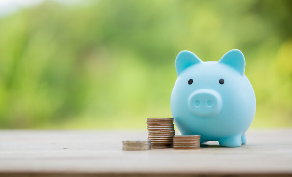 Savings For Business Investments Concept. Money Coin Stacking On Wood Desk In Green Background. Management Cash, Insurance Asset And Wealth, Tax Accounting Budget, Growth Loan Financial, Economic.