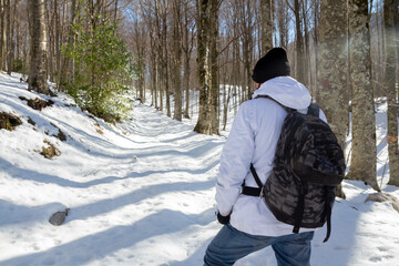 Fototapeta na wymiar hikers walking in the snow