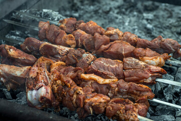 Cooking kebabs on skewers, closeup photo