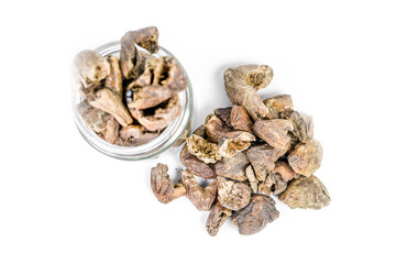 Pile of Organic Chebulic Myrobalan or Choti Harad or Terminalia chebula isolated on white background