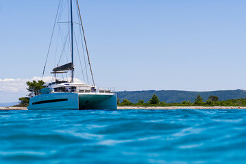 Catamaran sailing in ocean. paradise at sea. Blue sky and turquoise blue sea water. Mexican Caribbean beaches.