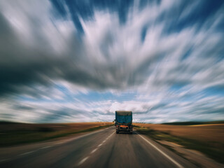 Obraz premium Truck is driving on an empty highway
