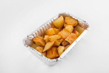 Baked potatoes served in aluminium tray