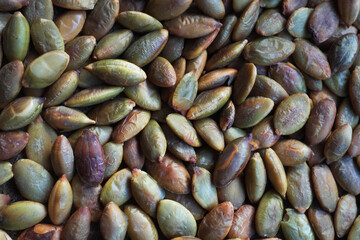 Peeled pumpkin seeds slightly burned in a pan ... 