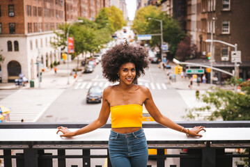 Beautiful afro-american woman walking in New York - Young black female adult tourist in Manhattan,...