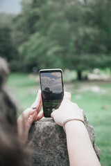 person taking a picture with a phone