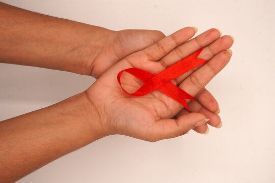 World aids day, red silk ribbon symbol of AIDS Awarenesss