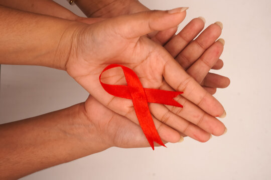 beautiful aids ribbon holding in multiple hands