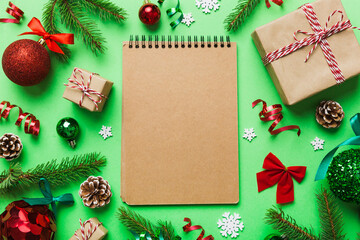 Christmas blank greeting card mock-up scene. Creative layout made of Christmas tree branches and paper card note. Flat lay. Nature New Year concept