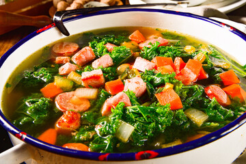 autumnal kale soup with sausage and bacon cubes