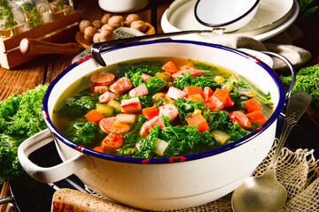 autumnal kale soup with sausage and bacon cubes