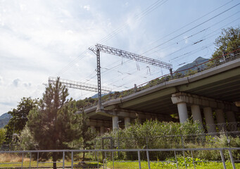 Metal poles with wires on the railroad.