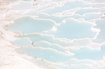 Emerald water in white limestone rock.