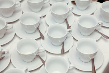 White tea cups with spoons
