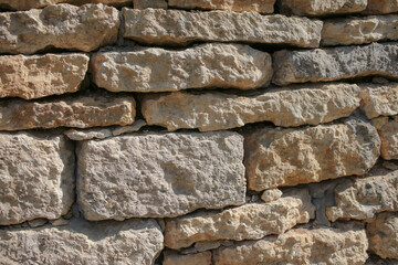 Obraz premium Wall of old stone bricks as an abstract background.