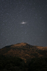 Andromeda Galaxy above a mountain