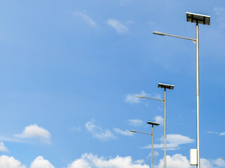 Street lamps with solar cell panel. Bright blue sky on the background.