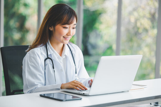 Doctor using online health consulting on computer pc and digital tablet, Tele medical healthcare concept