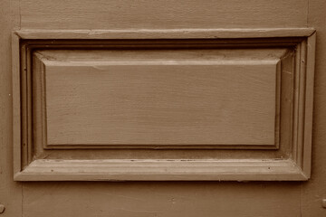 Decorative element in wooden door, wood background