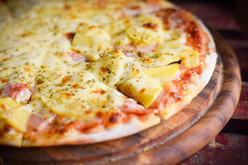 pizza hawaiian cheese on wood table. homemade food concept