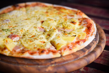 pizza hawaiian cheese on wood table. homemade food concept
