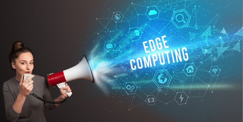 Young woman shouting in megaphone, technology announcement concept