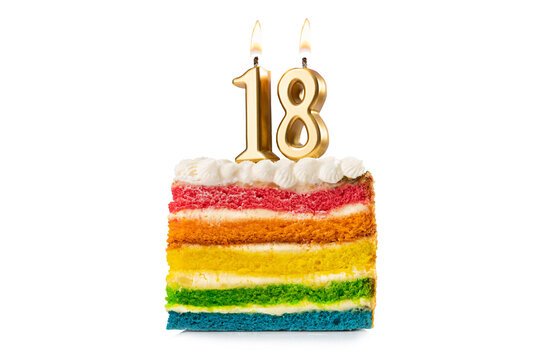 Rainbow cake dessert with 18 number candles birthday concept.