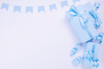 blue gift boxes with blue bows template for copy pasting, postcard, concept for celebrating a boy or man's birthday, party, anniversary or newborn