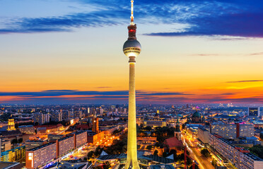 Fototapeta premium Aerial downtown panorama of Berlin at night with the skyscrappers and the bridges, Germany