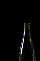 green glass bottle isolated on black background