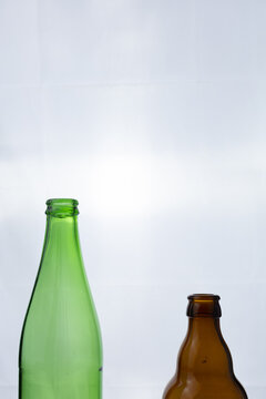green and brown beer bottles isolated on white background 