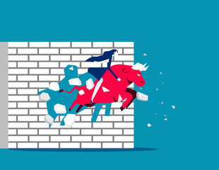 Breaking wall. Ride red bull and breaking wall. Business bull market concept