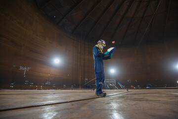 Male worker inspection visual tank oil steel