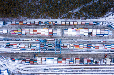 Aerial view of shipping container port terminal. Colourful pattern of containers in harbor....
