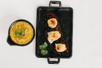Steam dumplings with mushroom sauces on the plate