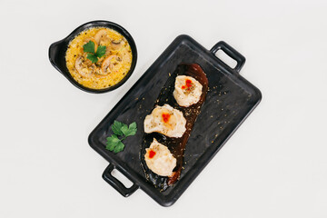 Steam dumplings with mushroom sauces on the plate