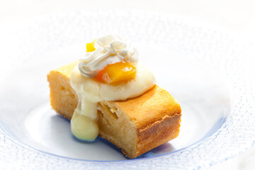 sponge cake with vanilla custard, peach and whipped cream
