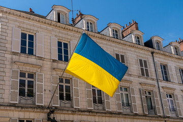 blue yellow flag on a historic building in Orleans