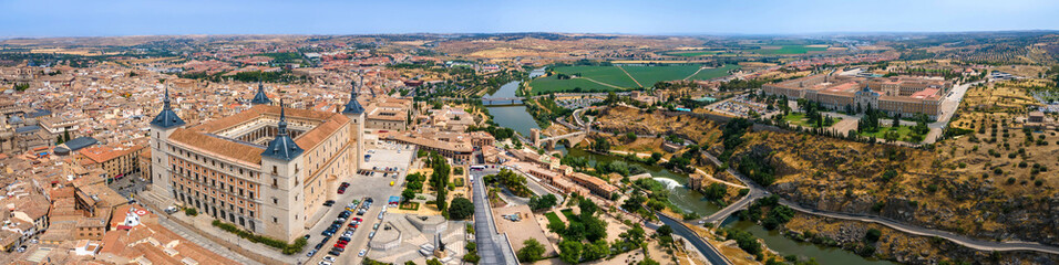 A panoramic aerial view of Toledo with the Alcazar fortress, Tagus River, and Infantry Academy