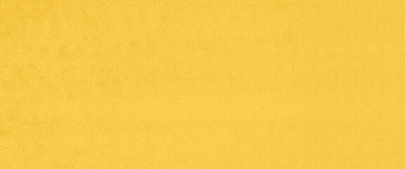 Surface yellow cement wall painted texture, abstract bright yellow background, vintage orange paper texture.
