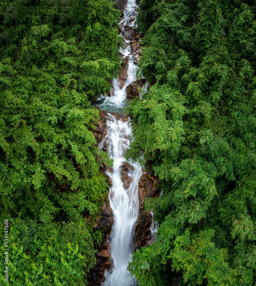 Wall mural beautiful nature landscape krating waterfall and small photographer in the rainy season and refreshi