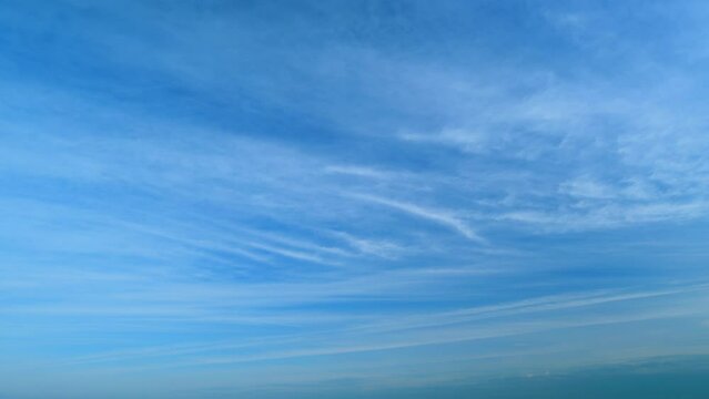 Clouds in tropical summer sunshine day. White cirrus cloud or cirrostratus cloudscape. Timelapse.