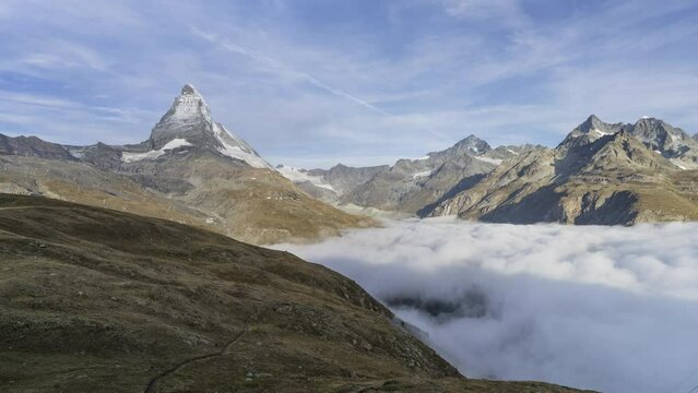 Timelapse Sea of mist at Matterhorn Mountain near Bruder Klaus, Riffelberg Chapel, Riffelsee Zermatt, Switzerland.