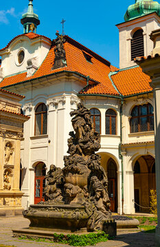 Prague, Czech Republic - May 14, 2018:  Courtyard of the Loreta monastery with beautiful baroque buildings and statues.