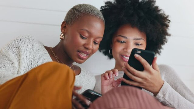 Relax friends with smartphone talking social media gossip, surfing internet or having funny conversation of meme content on app. Black people, women or gen z couple watching mobile web video online