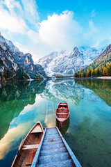 Magical autumn landscape with boats on the lake on Fanes-Sennes-Braies natural park in the...